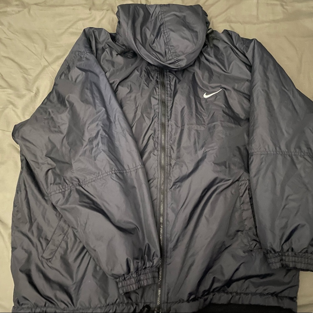 Vintage embroidered nike wind breaker w fleece lining.